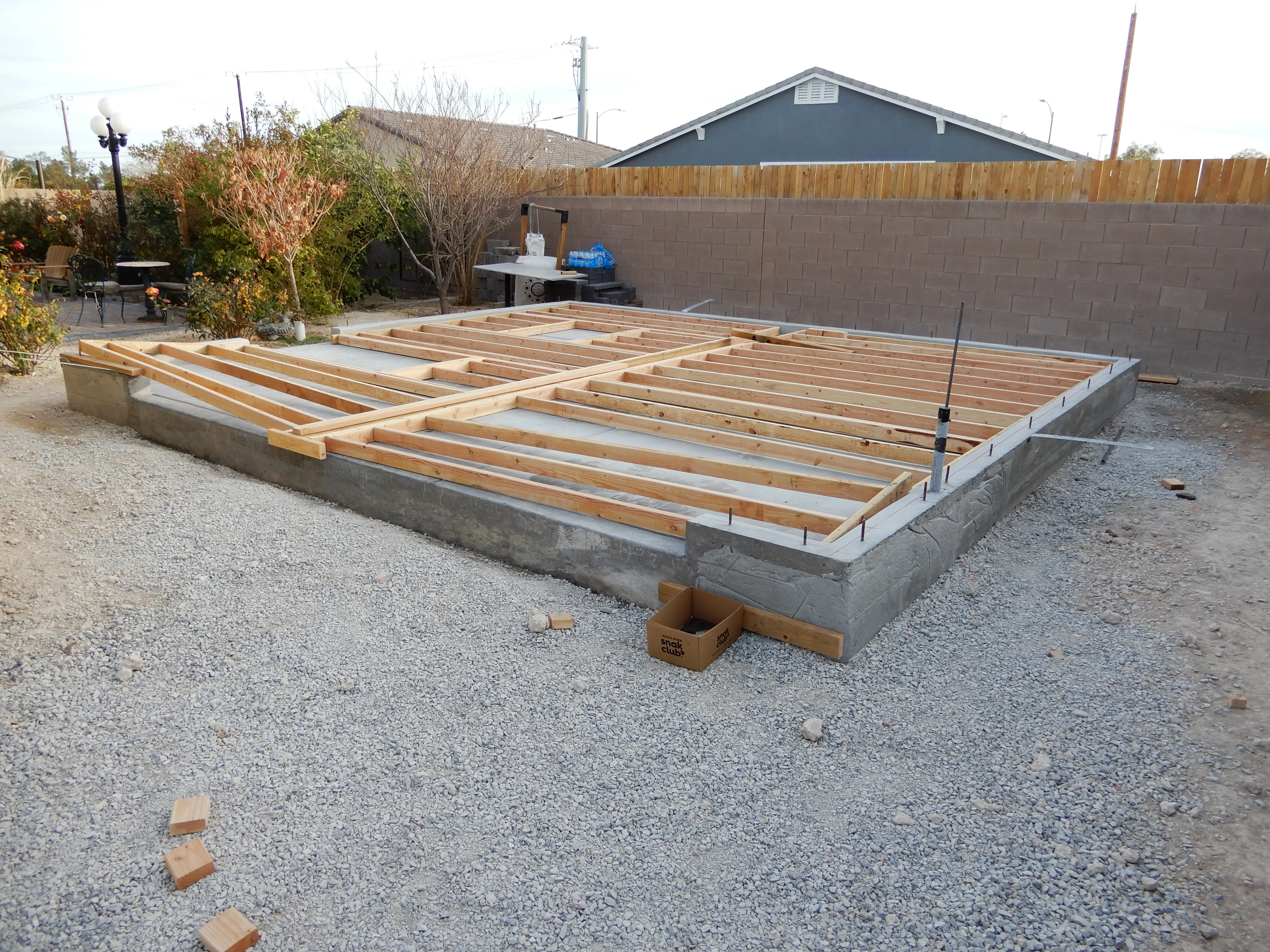Concrete deck foundation with wooden joist framing in Las Vegas backyard